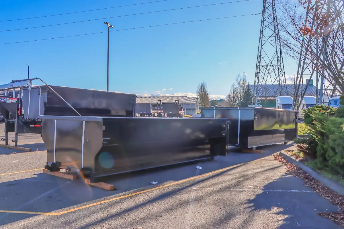 Roll-off dumpster ready for waste disposal at job site for Yard Waste Dumpster Rental in Jefferson City